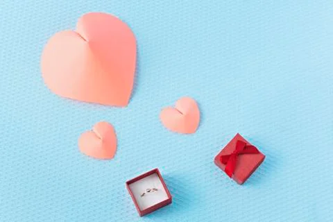 Hearts and ring on a blue background. Valentine's Day. Valentines day greetin Stock Photos