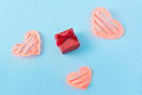 Hearts and ring on a blue background. Valentine's Day. Valentines day greetin Stock Photos