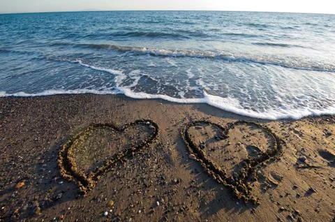 Hearts on beach Stock Photos