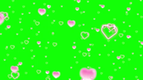 Hearts floating on green background Stock Footage 336590723