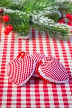 Hearts on gingham tablecloth Stock Photos