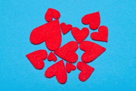 Hearts laid out on a blue background Stock Photos