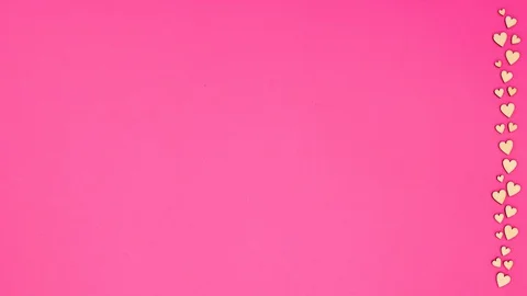 Hearts moving o right side of pink background - Stop motion Stock Footage 128846951