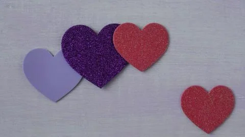 Hearts on pink wood background Stock Photos