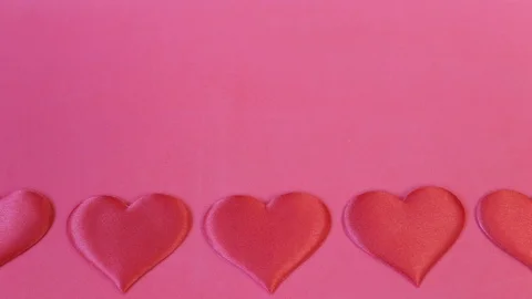 Hearts on a red background Stock Footage 123954791