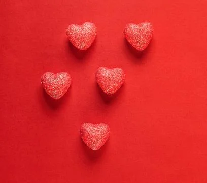 Hearts on red background. Stock Photos