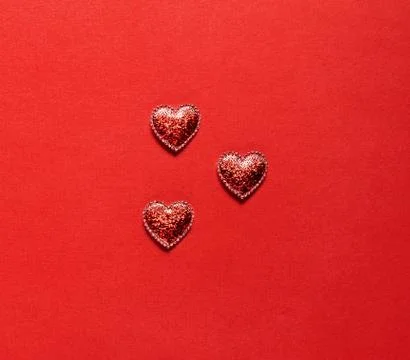 Hearts on red background. Stock Photos