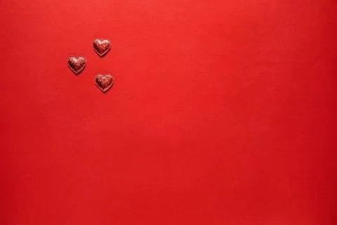 Hearts on red background. Stock Photos