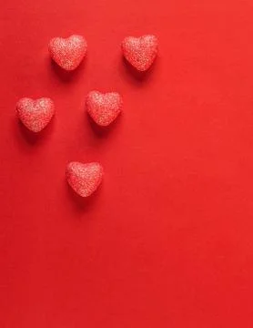Hearts on red background. Stock Photos