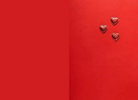 Hearts on red background. Stock Photos