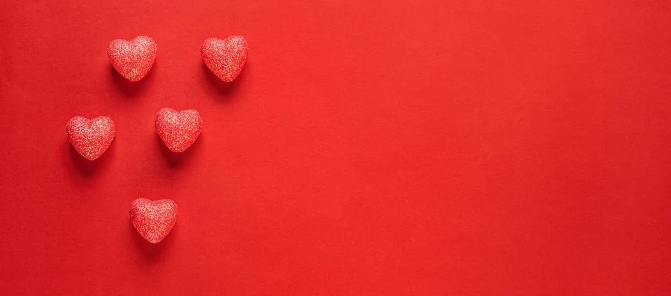 Hearts on red background. Stock Photos