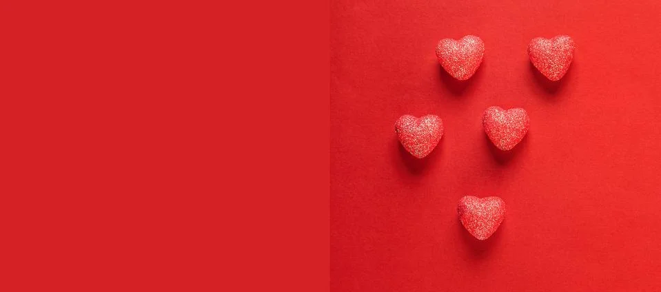 Hearts on red background. Stock Photos