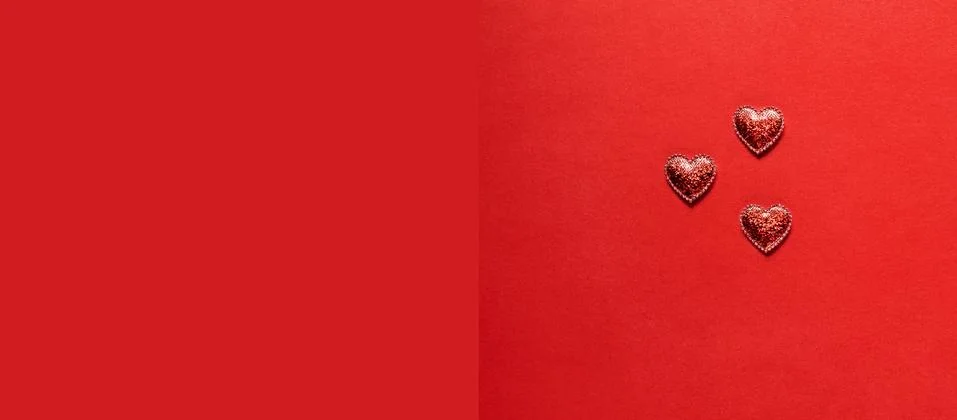 Hearts on red background. Stock Photos