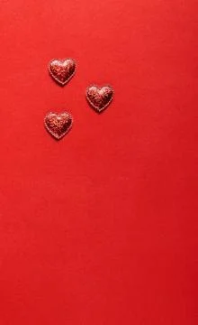 Hearts on red background. Stock Photos