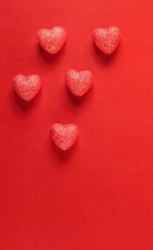 Hearts on red background. Stock Photos