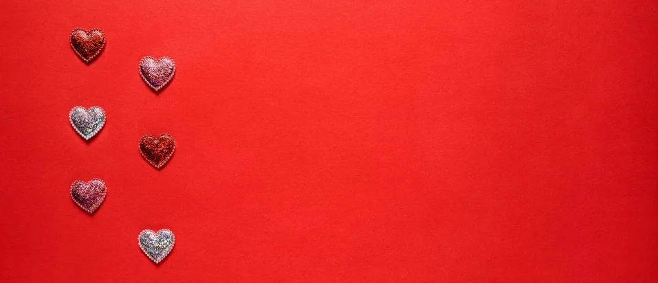 Hearts on red background. Stock Photos