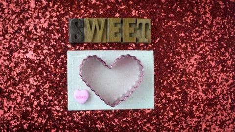 Hearts on red glitter background Stock Photos