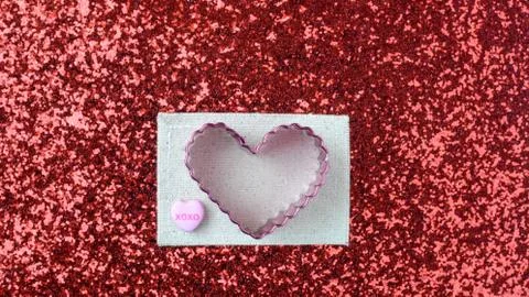 Hearts on red glitter background Stock Photos
