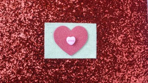 Hearts on red glitter background Stock Photos