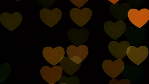 Hearts sparkle with different lights and fall down. Valentine's Day Stock-Footage 146663309