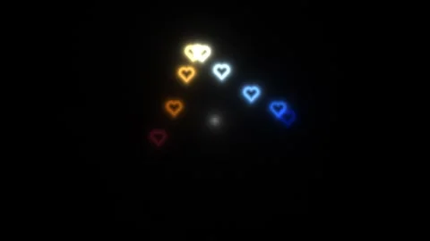 Hearts in various colors light up a dark background Stock Footage 338032450