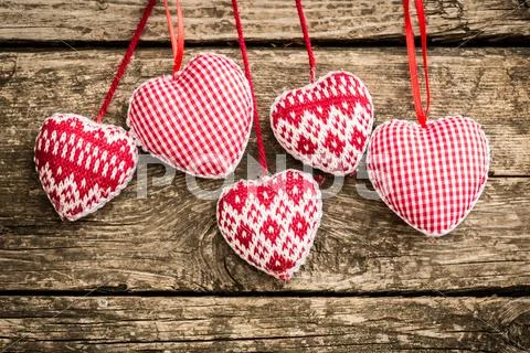 Hearts on wooden background Stock Photos