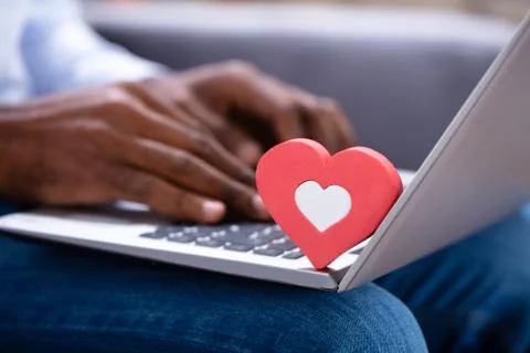 Heartshape On Keypad While Man Using Laptop Stock Photos