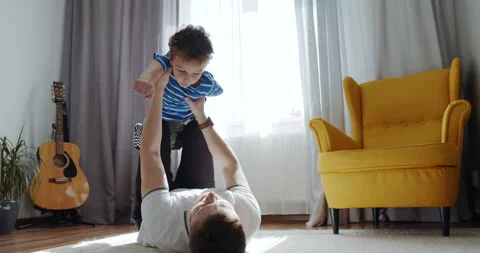 A heartwarming video of a father playing lovingly with his child Stock Footage 306846886