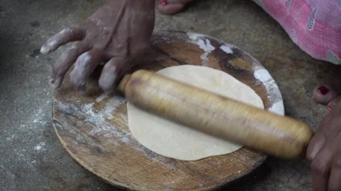 Heat a flat pan, place rolled dough, flip as bubbles form 스톡 동영상 289469291