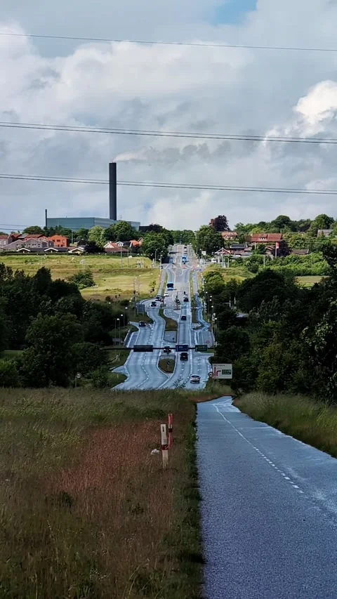 Heat haze and mirage distorting a busy road with cars on a hot summer day Video stock 335637244