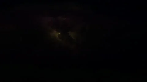 Heat lightning illuminates clouds in the night sky, 4K Stock Footage 52609207