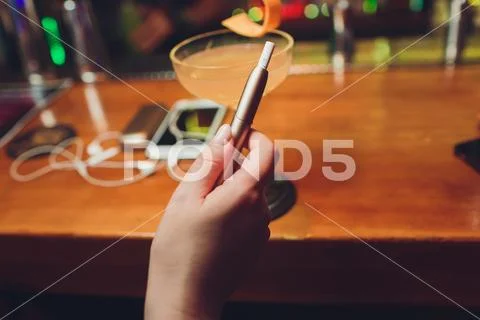 Heat-not-burn tobacco product technology. e-cigarette before smoking. Stock Photos