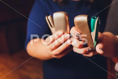 Heat-not-burn tobacco product technology. e-cigarette before smoking. Stock Photos