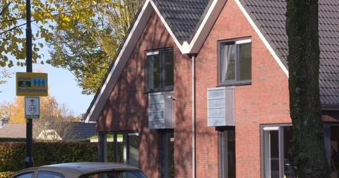 Heat pump fan unit integrated on the facades of new-build homes Stock Footage 120131260