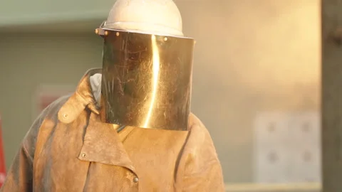 Heat Resistant Coat and Visor in Engineering Steel Foundry Close Up Видео 345002720