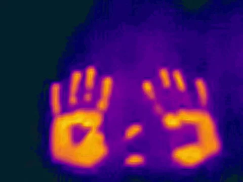 Heat transfer between hands and surface captured with thermal camera Видео 241741811