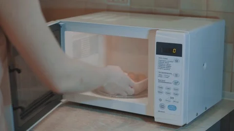 Heated food in the microwave Stock Footage