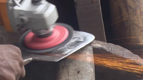 Heated Iron Hammered into Knife in Workshop Stockbeeldmateriaal 319958588