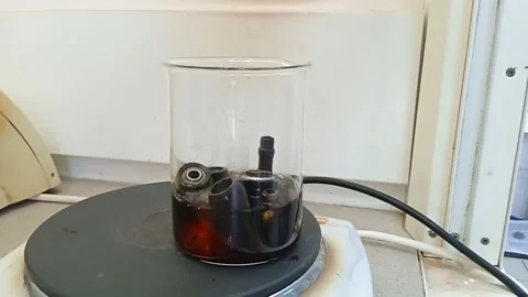 Heated, researched objects for drugs in a flask with saline Stock Footage 229722081