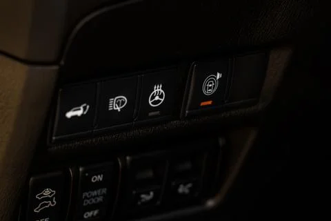 Heated steering wheel switch. Steering wheel heating control panel close up v Stock Photos