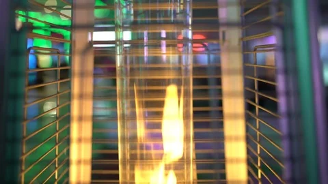 Heater open fire at an outdoor cafe in winter time. UHD 4K Stock Footage 71929633