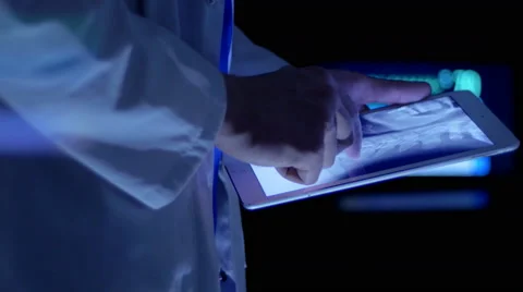 Heath professional analyzing a head and neck x-ray in the hospital Video stock 67262683
