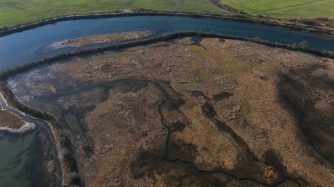 Heather and brush overhead tracking river in marshland Pt 4 of 4- 4K Video stock 227242728