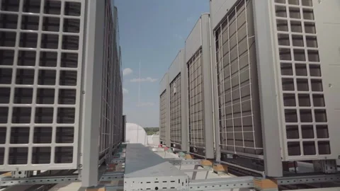Heating and cooling air conditioner unit on roof. Gimbal stabilizer shot Stock Footage 249963290