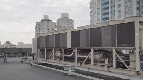 Heating and cooling air conditioner unit on roof. Gimbal stabilizer shot Stock Footage 249963352