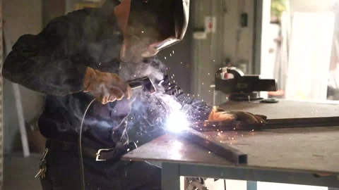 Heating and welding metal object in industrial space Stock Footage 241818210