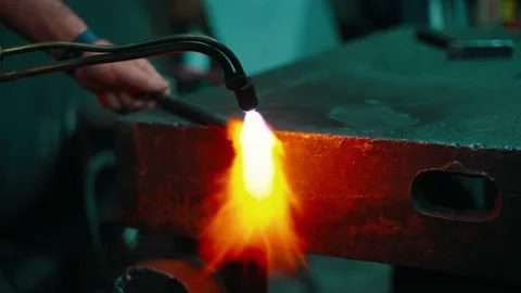 Heating the billet with a gas burner before forging Stock Footage 236840432