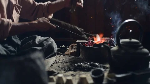 Heating charcoals for melting the silver Stock Footage 71179022