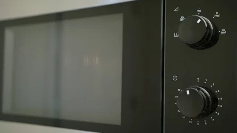 Heating a Container with Food in a Microwave Oven Stock Footage 82641891
