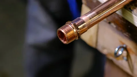 Heating a copper pipe and fitting before soldering Stock Footage 139367684